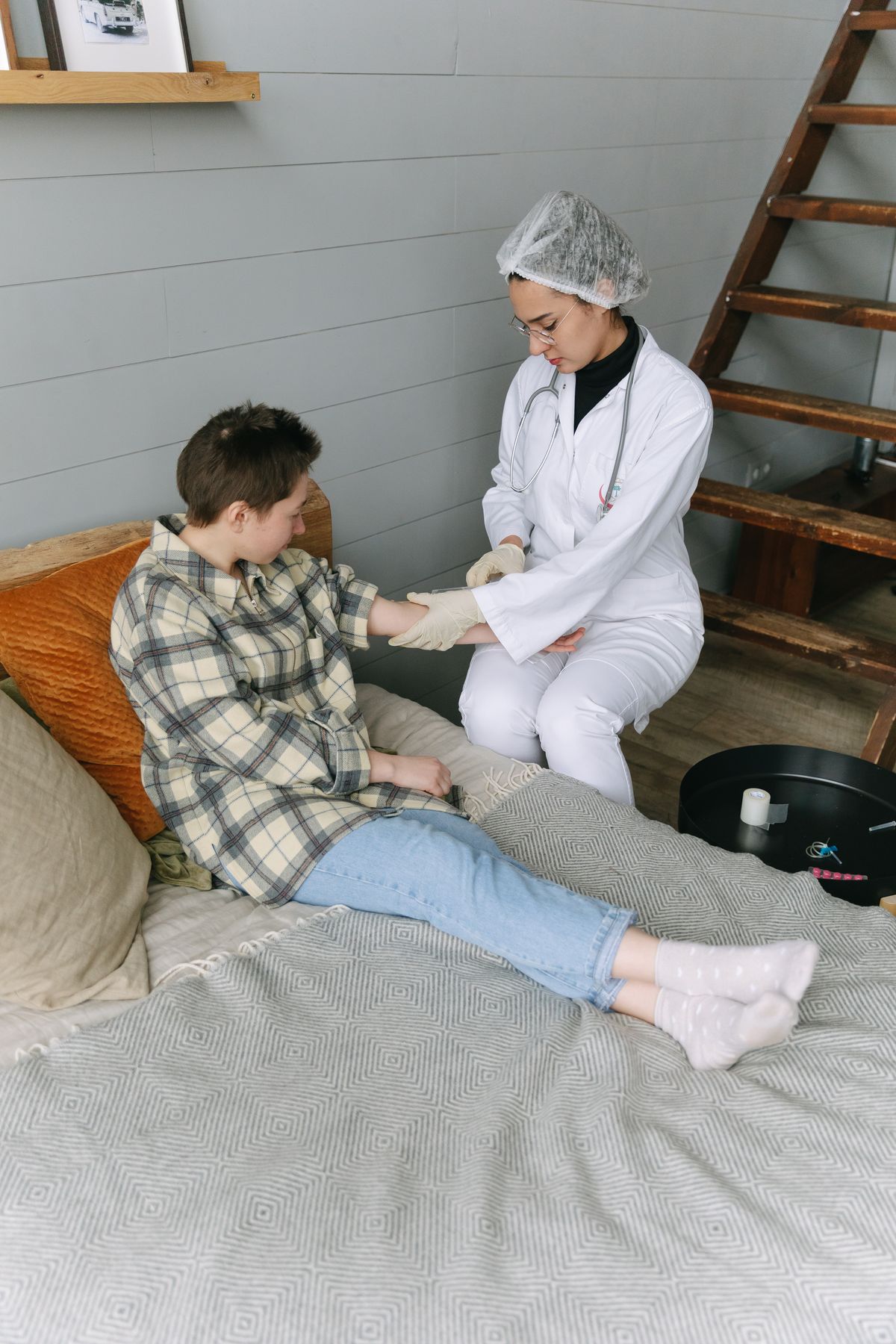Healthcare professional attending to a person at home